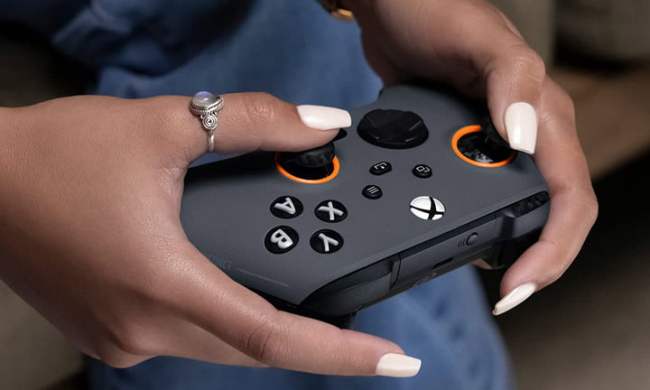 Hands holding the Scuf Instinct Pro controller.