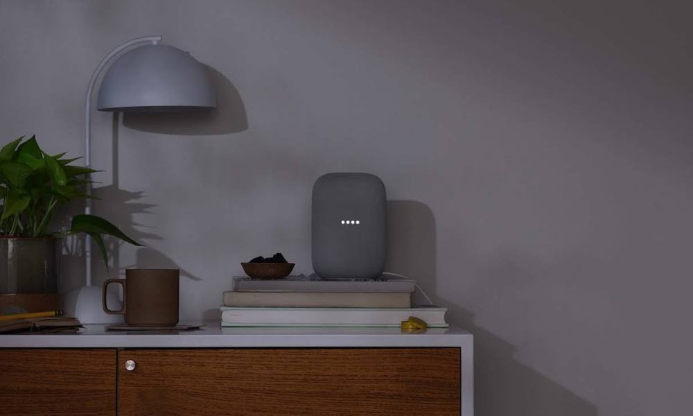 nest speaker on a nightstand with light off