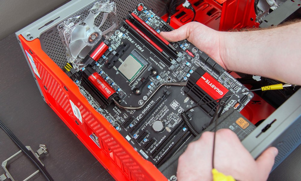 Installing a motherboard in a desktop PC case.