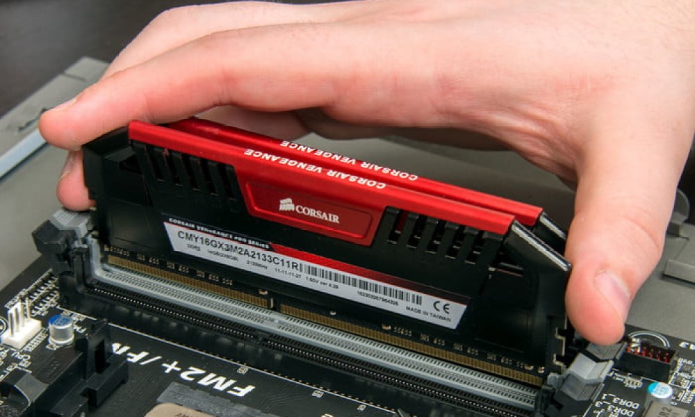 Installing RAM sticks in a motherboard.