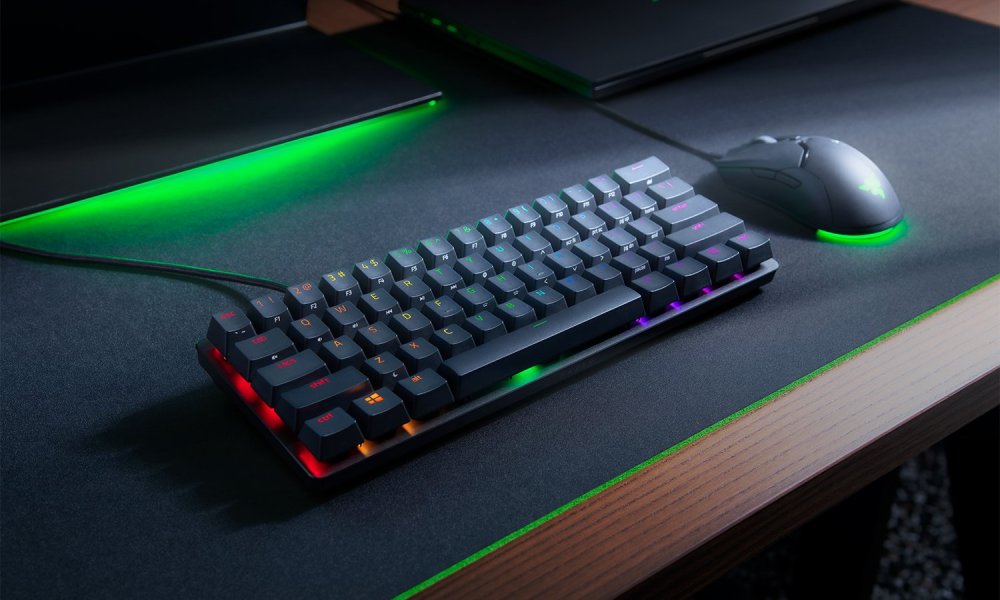 Razer Hunstsman Mini 60-percent keyboard on gray and green deskpad.