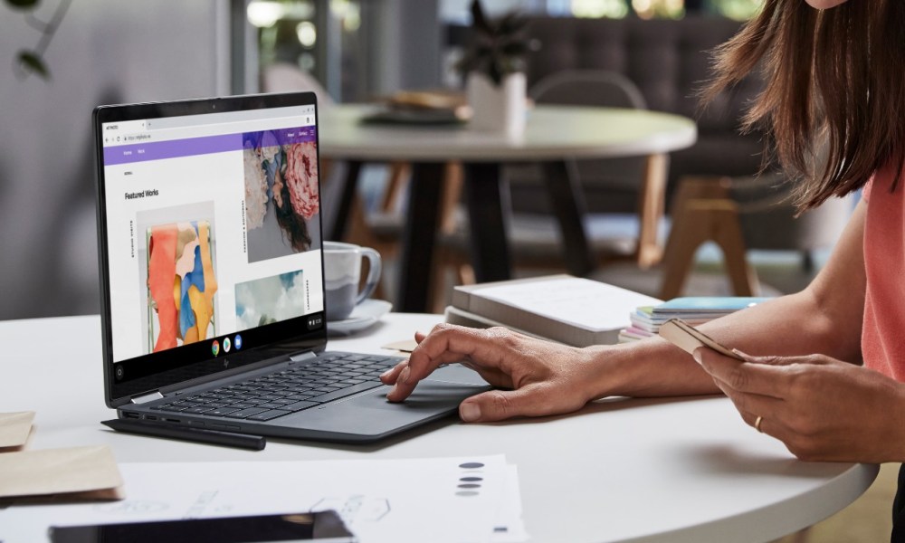 A woman uses the trackpad on an HP Elite Dragonfly Chromebook 3.