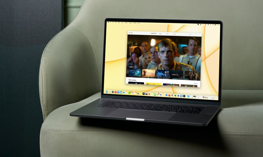 MacBook on a chair with the TV app on the screen.