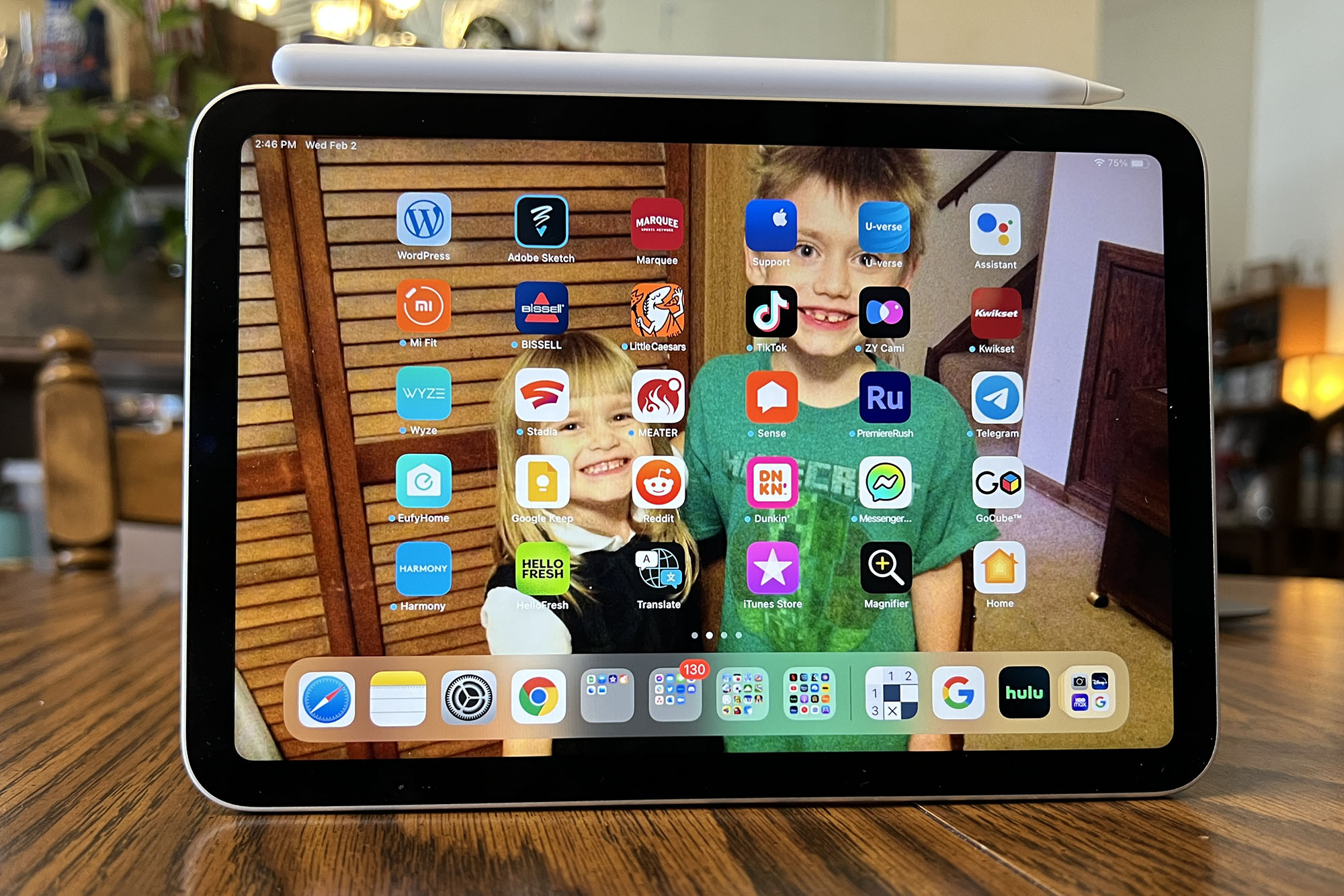 An iPad Mini in landscape mode displaying its home screen.