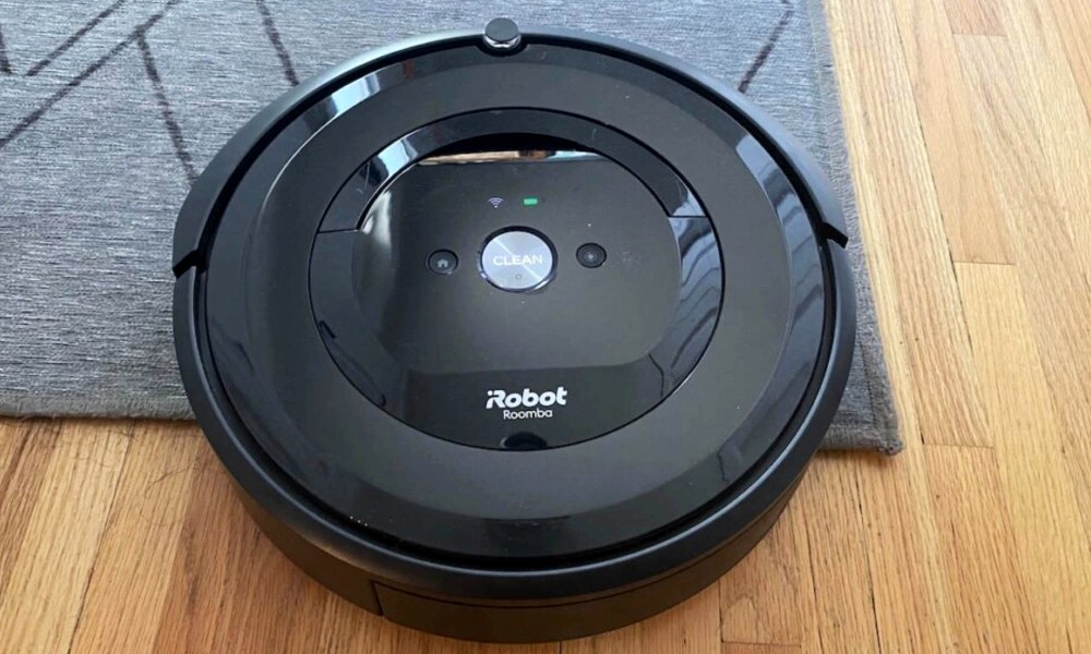 A iRobot Roomba e5 sits on the floor.