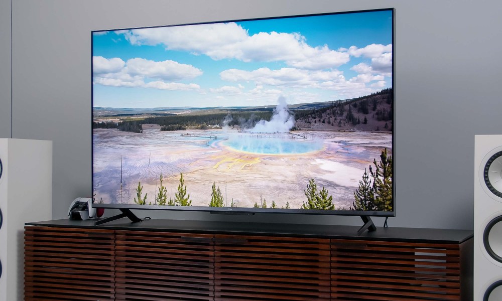 An image of Yellowstone National Park is seen on the TCL 6-series Google TV's display.