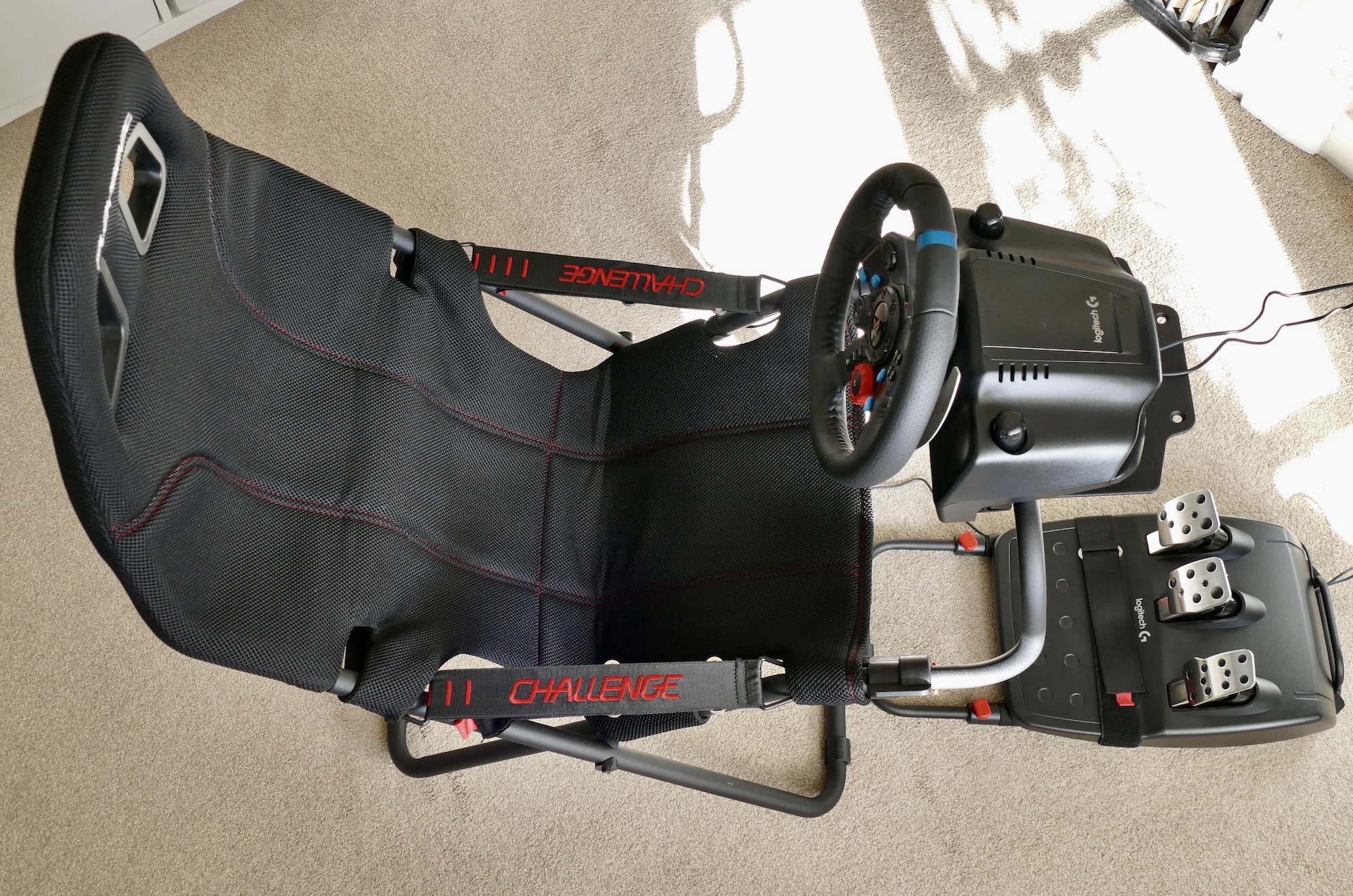 The PlaySeat Challenge and the Logitech G29 steering wheel viewed from above.