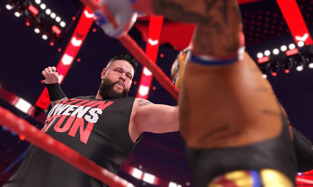 Kevin Owens punches Rey Mysterio in WWE 2K22.