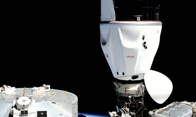 A SpaceX Crew Dragon spacecraft docked at the space station.