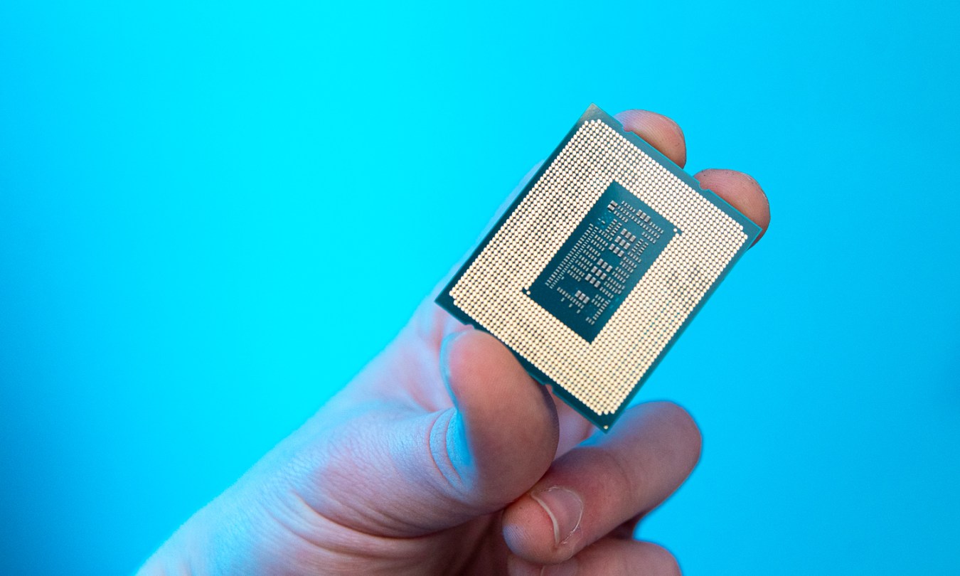 Someone holding the Core i9-12900KS processor.