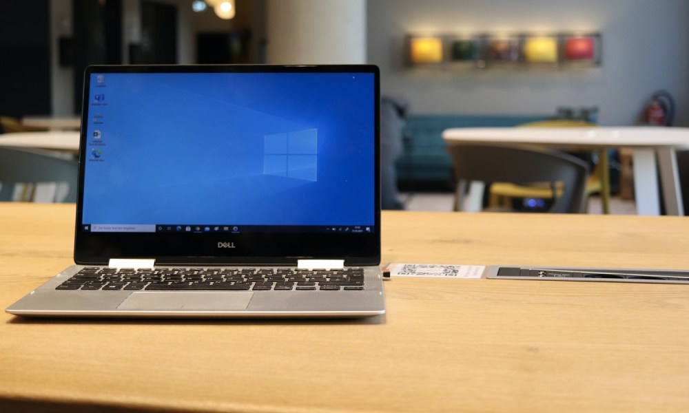 A Dell laptop with Windows 10 sitting on a desk.