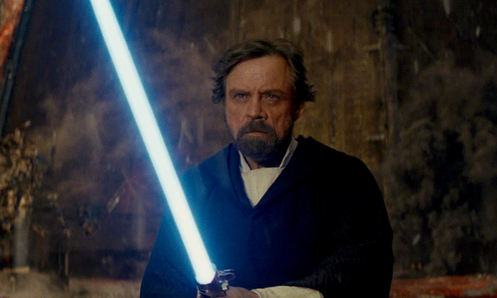 Luke Skywalker with a blue lightsaber at the climax of The Last Jedi.