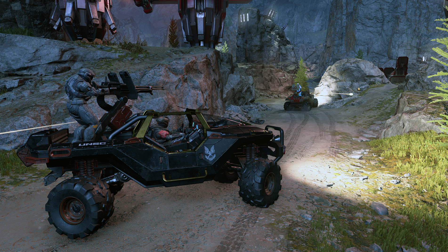 Two Spartans in a Warthog in Halo Infinite.