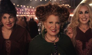 The Sanderson sisters smiling while at a fair in Hocus Pocus 2.