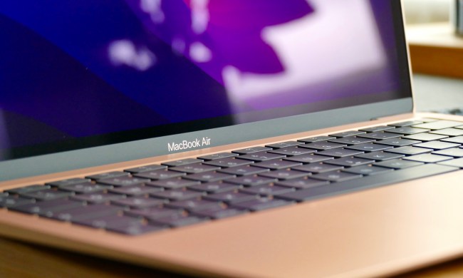 The gold MacBook Air M1's logo and keyboard.