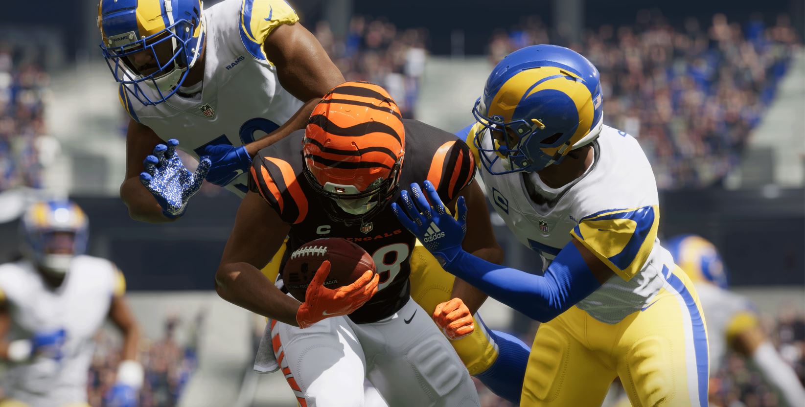 Joe Burrow gets tackled by Chargers players in Madden NFL 23.