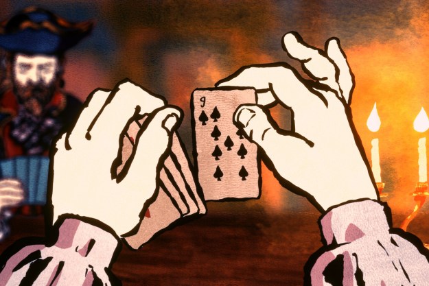 A still from Cardshark where a player holds up a 9 of spades.