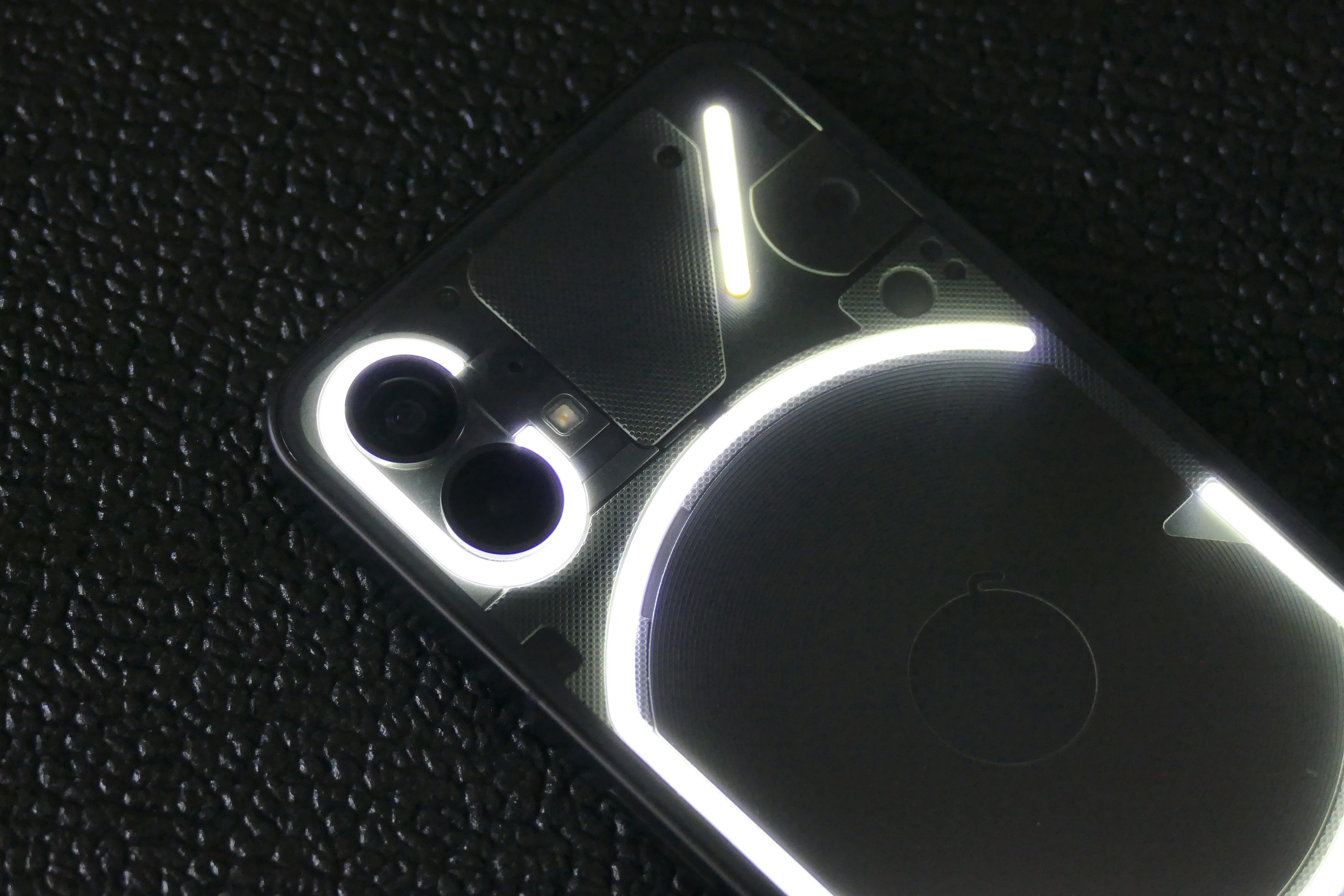 The Glyph Interface showing around the Nothing Phone 1's camera module.