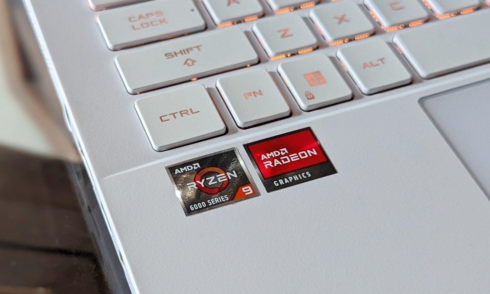 The AMD Ryzen CPU and Radeon GPU stickers on the ASUS ROG Zephyrus G14 2022 laptop.