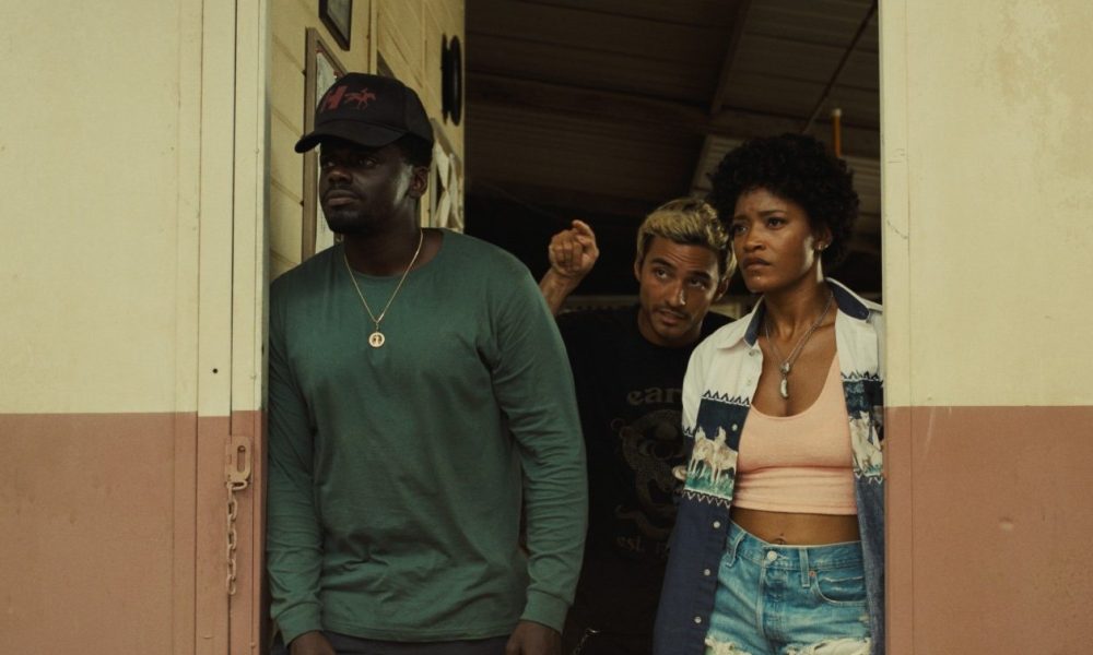 Daniel Kaluuya, Brandon Perea, and Keke Palmer stand in a doorway in a scene from Nope.