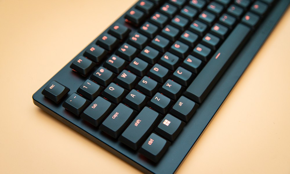 Razer DeathStalker V2 sitting on an orange background.