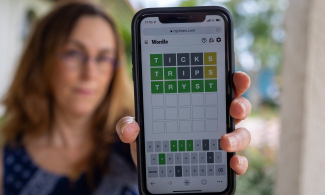 Woman holding an iPhone with Wordle.