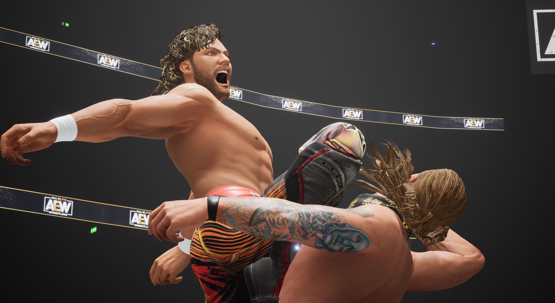 Ein Wrestler kniet seinem Gegner ins Gesicht.