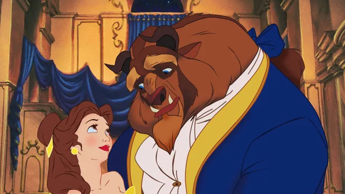 Belle and Beast looking lovingly at each other in Beauty and the Beast.