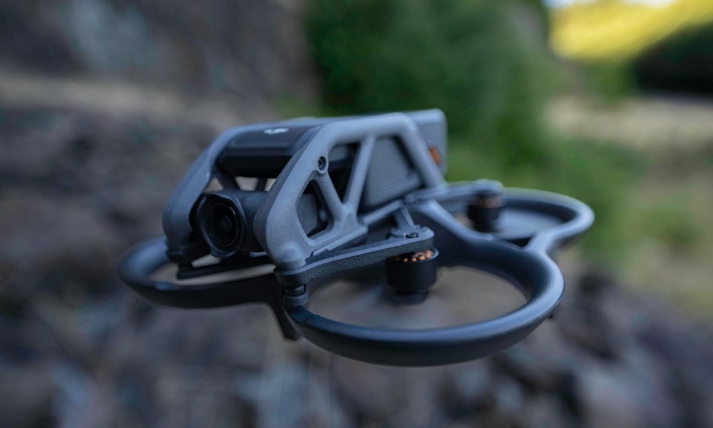 The DJI Avata flying over a boulder field.