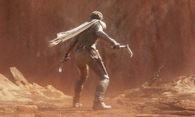 Character from Dune Awakening looking at a sandstorm.