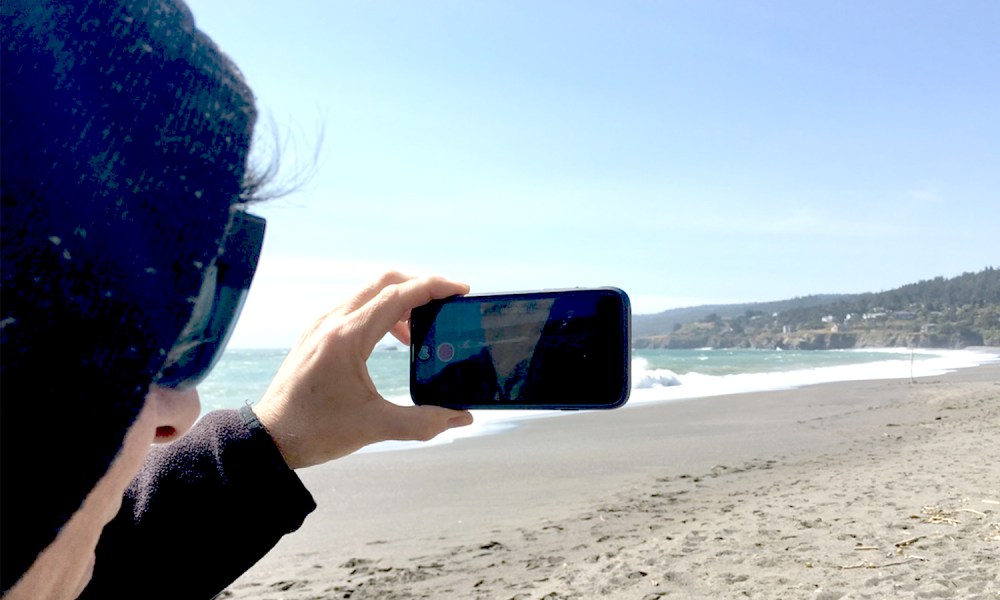 iPhone at the beach feat image.