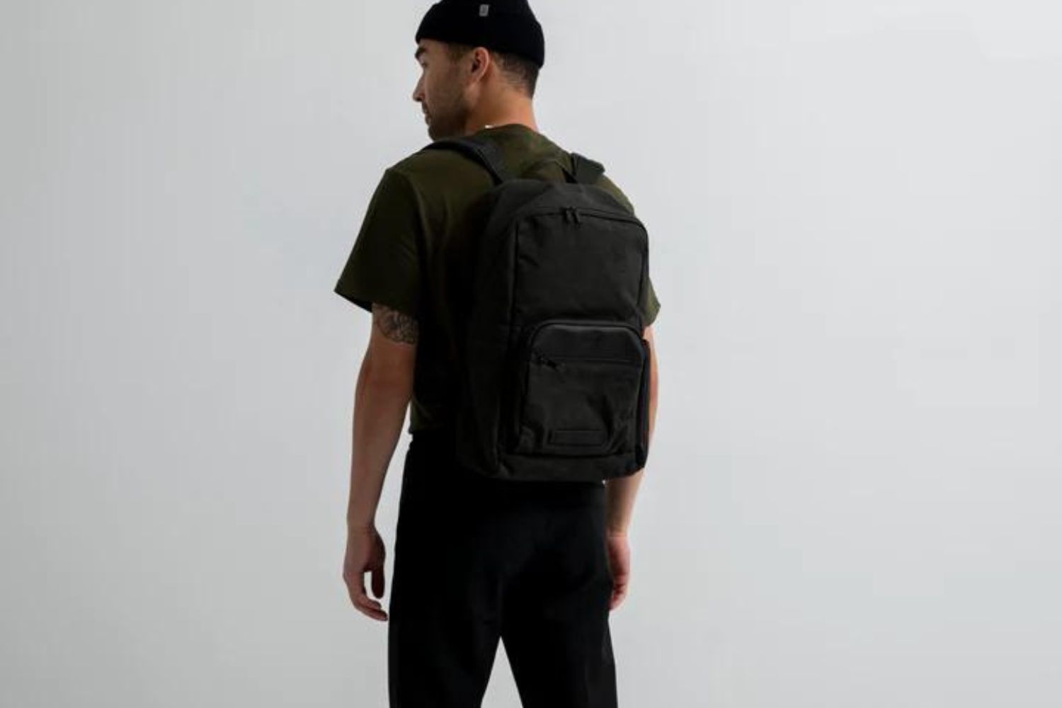 A man carrying the Timbuk2 Project against a blank backgorund.