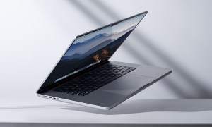 The Apple MacBook Pro 14 laptop propped up at an angle on a desk.