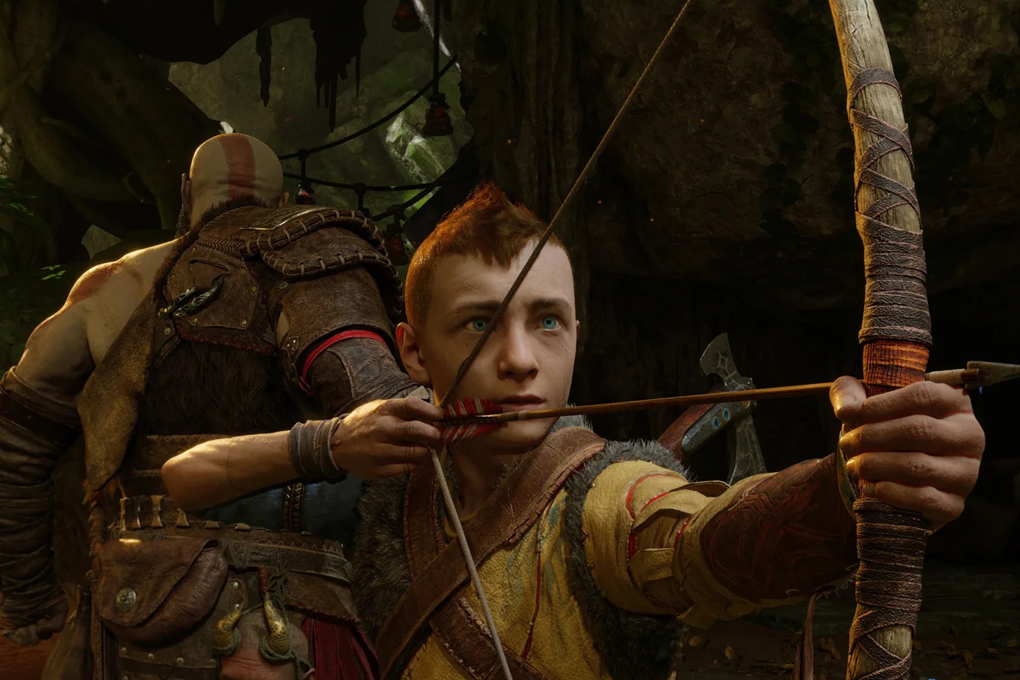 Atreus aims his bow in God of War