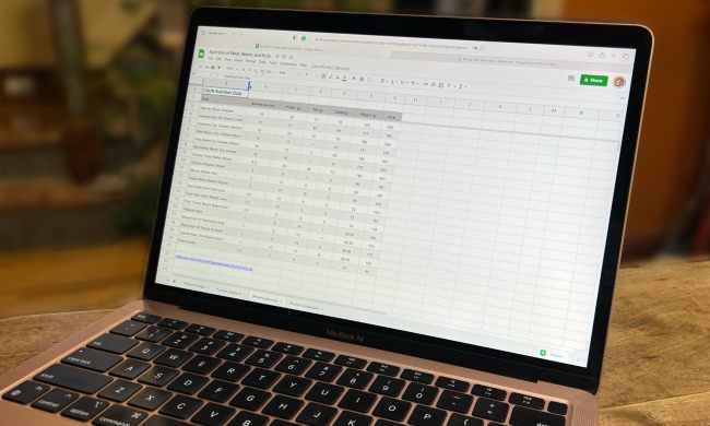 Google Sheets is open in the Safari browser on a MacBook Air.