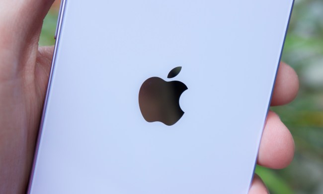 The Apple logo on the back of an iPhone 14.