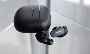 Bose QuietComfort Earbuds II beside charging case.