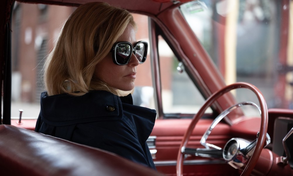 Elizabeth Banks wears sunglasses in a car in Call Jane.