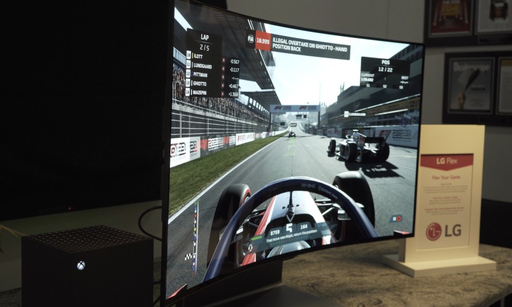 LG OLED Flex TV with racing game on screen, screen curved