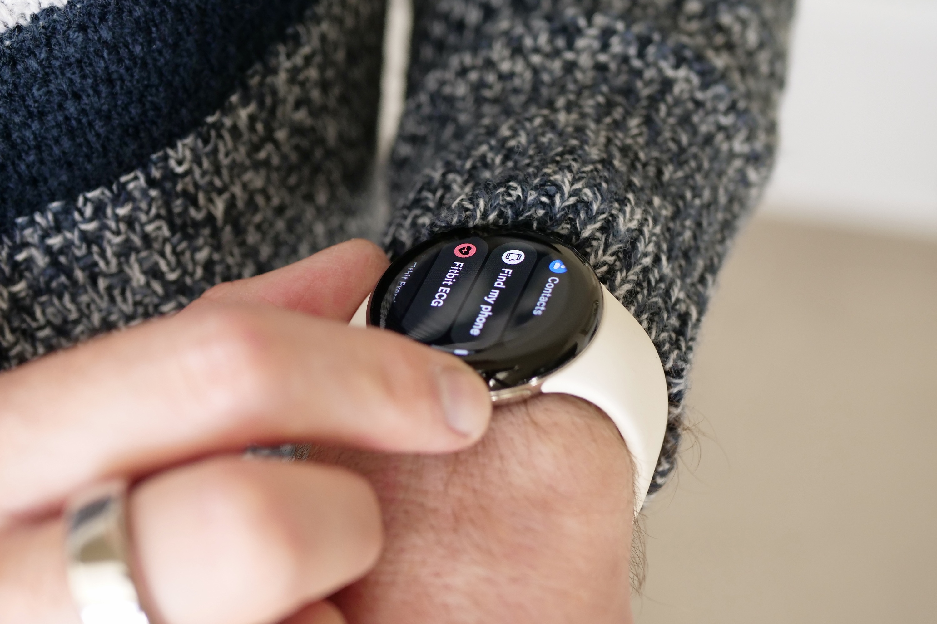 Man using the Google Pixel Watch's app menu.