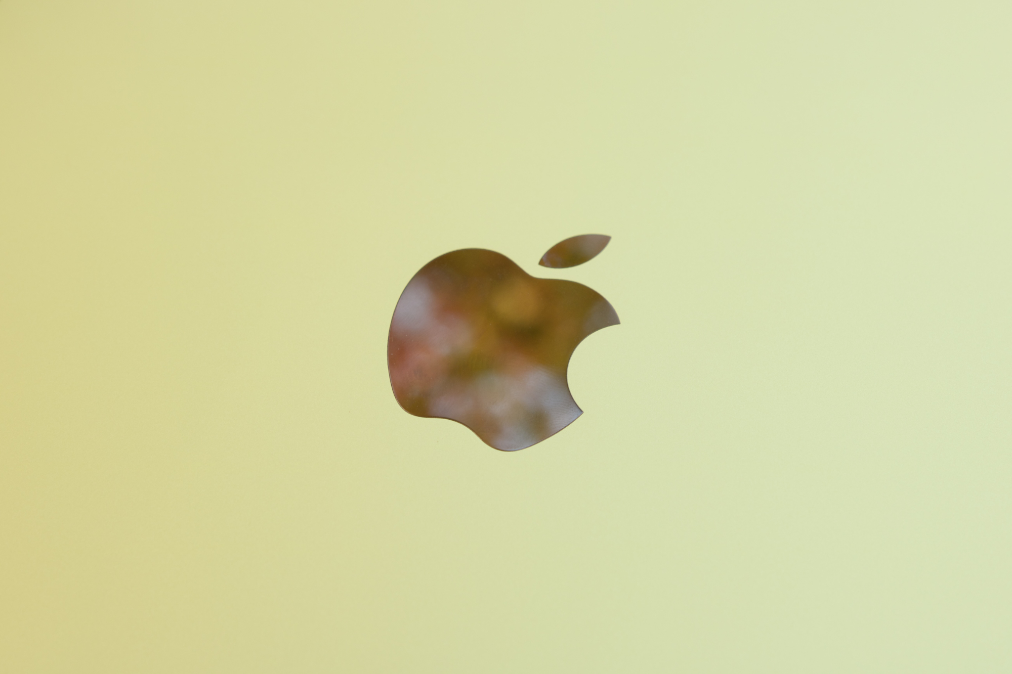 The Apple logo on the yellow iPad (2022).