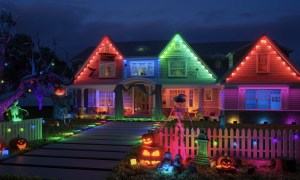 Govee Permanent Outdoor Lights strung up on a house at night for Halloween.