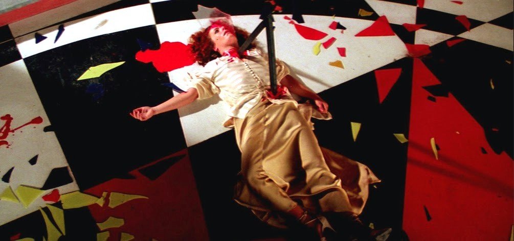 A woman lies dead on the ground in Suspiria.