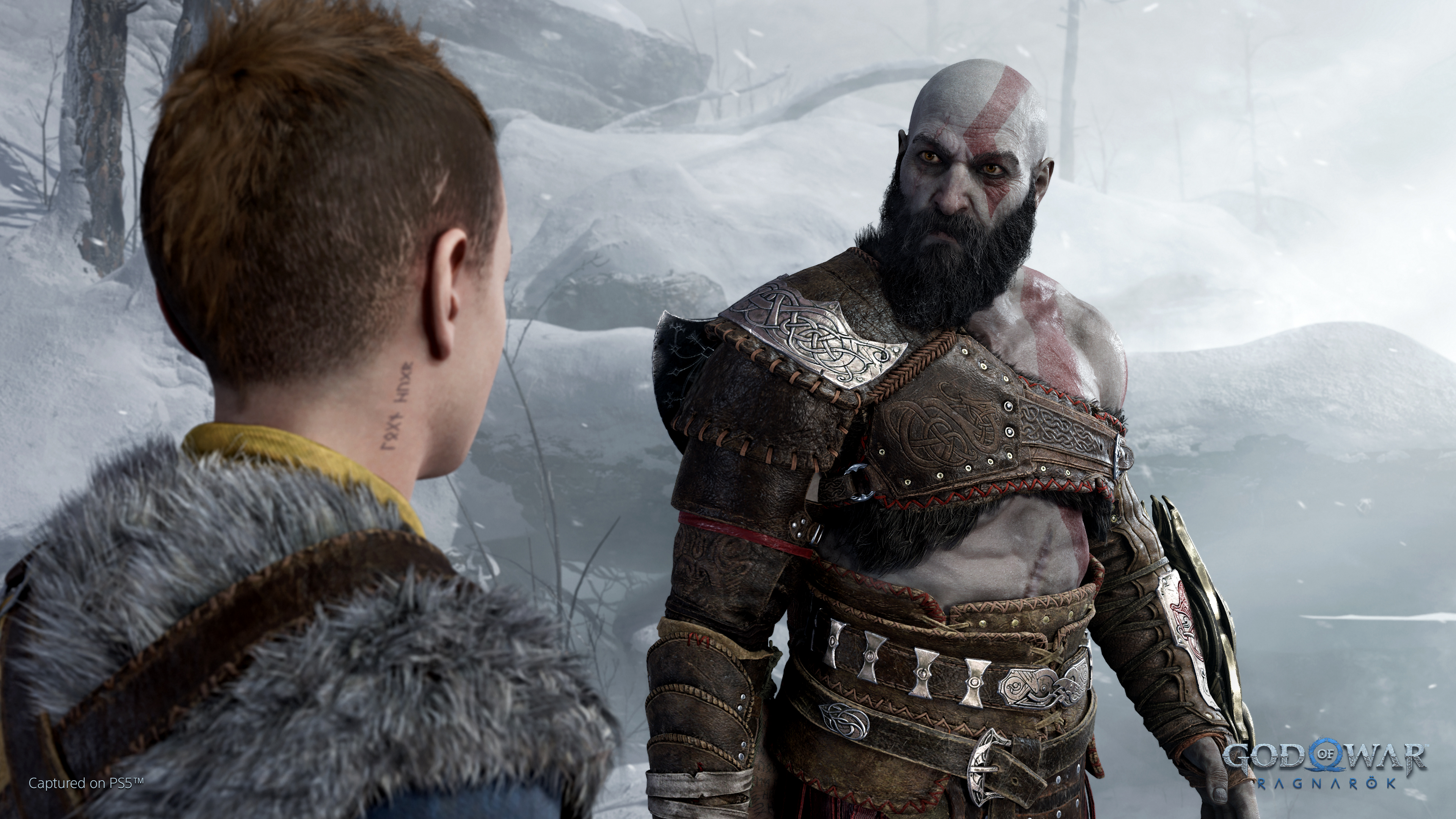 Kratos sternly looks at Atreus in God of War: Ragnarok.