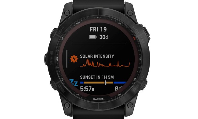 The Garmin Fenix 7X smartwatch with stats on the screen.