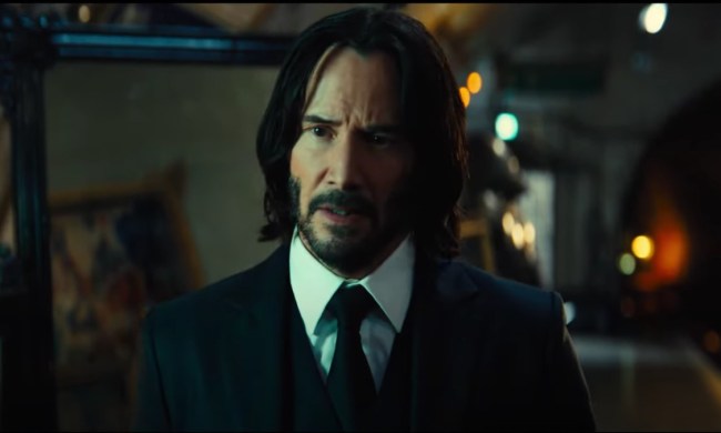 Keanu Reeves stares and walks in a scene from John Wick: Chapter 4.