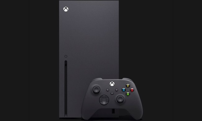 A black Xbox Series X and controller against a black background.