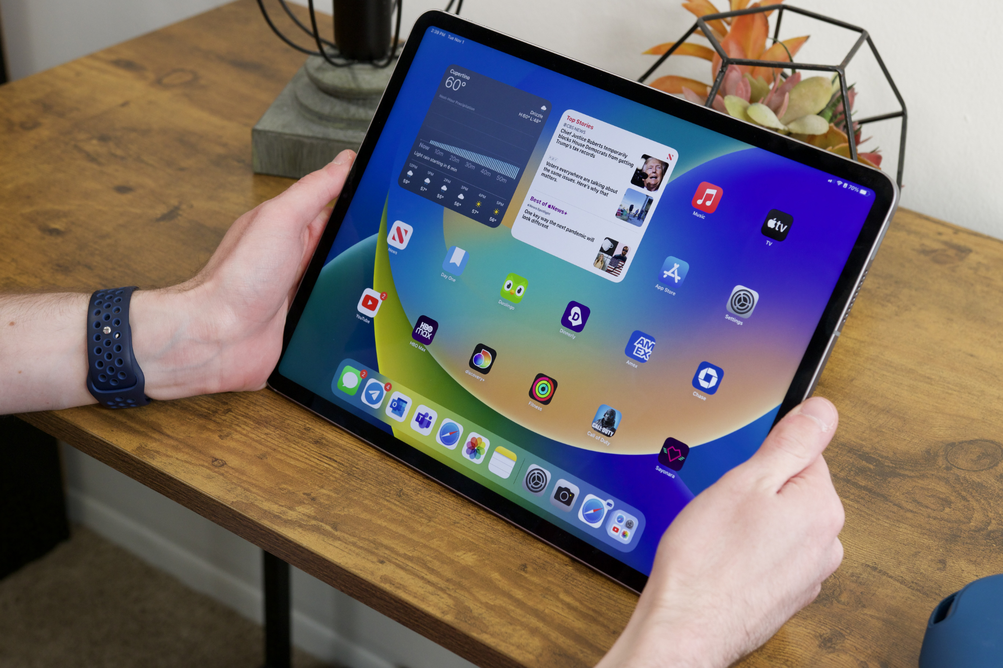 Someone holding the 12.9-inch version of the iPad Pro (2022).
