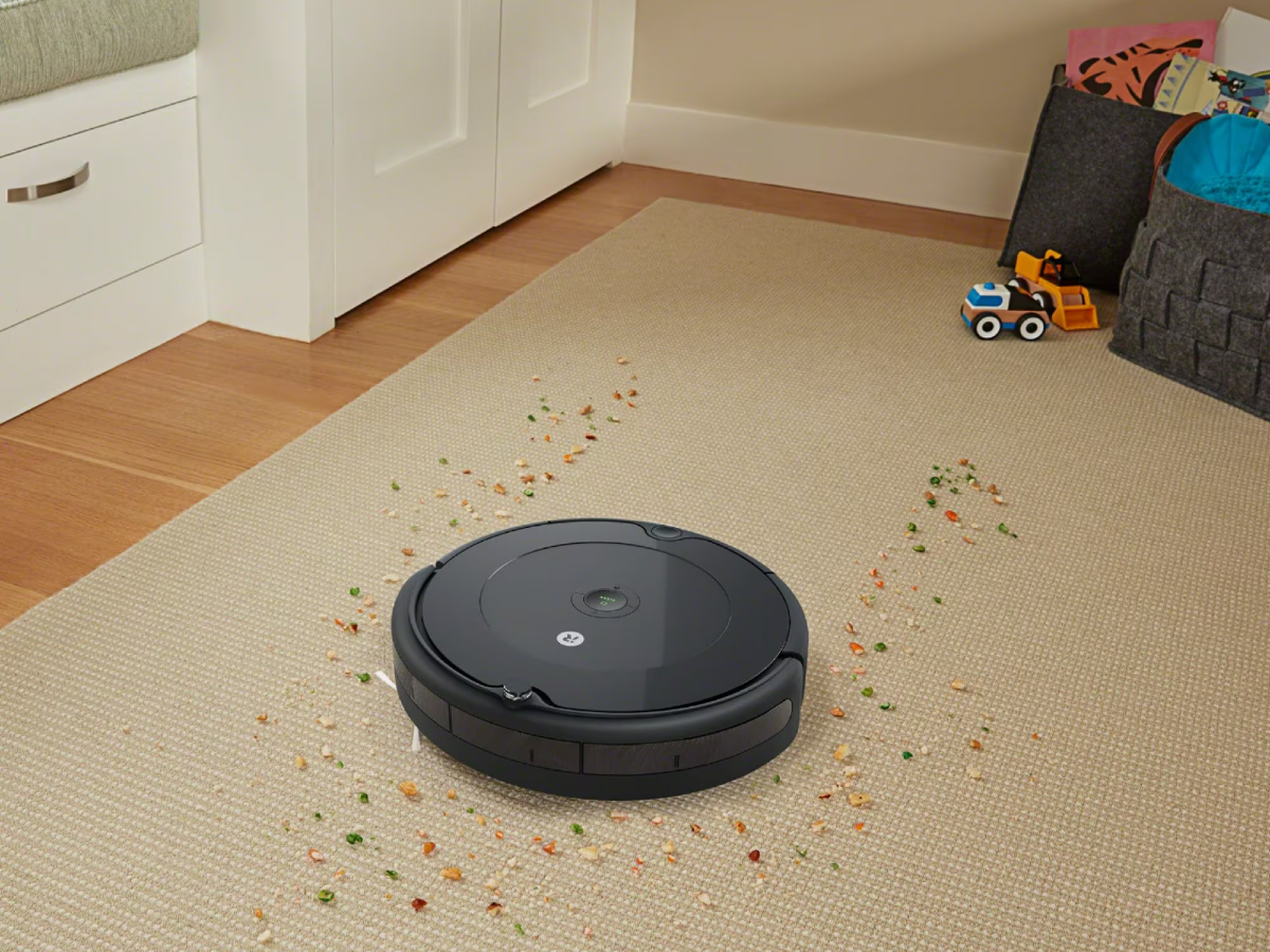 iRobot Roomba 694 Wi-Fi Connected Robot Vacuum cleaning up spilled cereal.