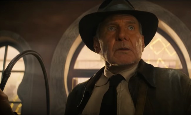 Harrison Ford as Indiana Jones holds a whip whole looking confused in Indiana Jones and the Dial of Destiny.